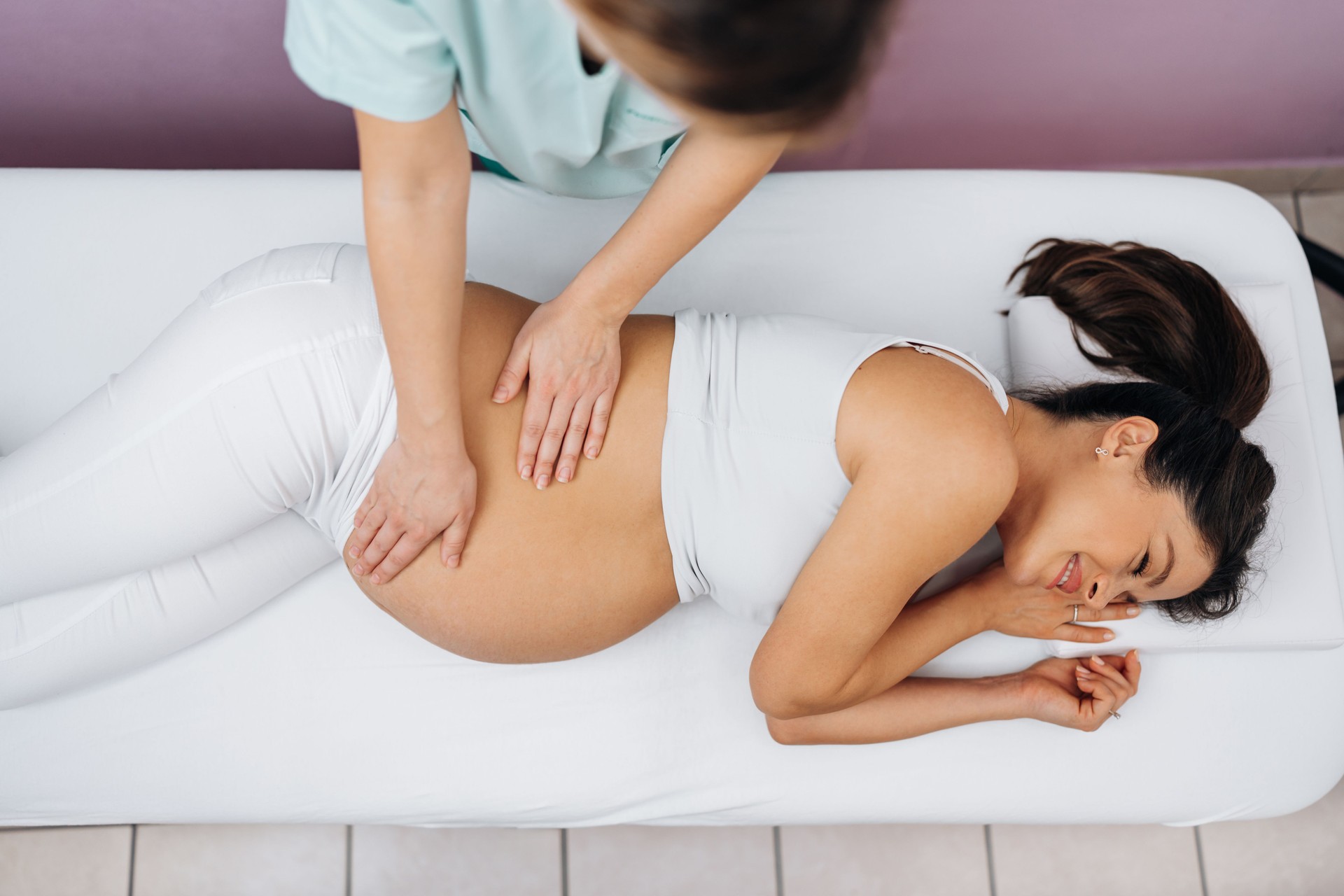 Pregnant woman at relaxing massage